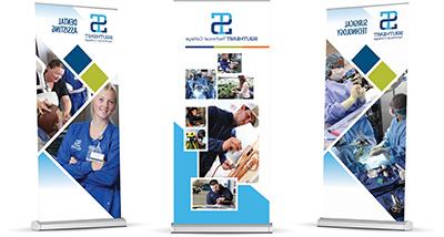 Three banner stands with STC imaging on a white background